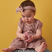 child with Wrist Teether - Blush - b.box for kids