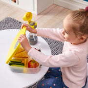 child with lunchbox - blue slate - b.box for kids